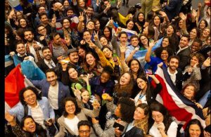 Group of scholars cheering at the Chevening Orientation