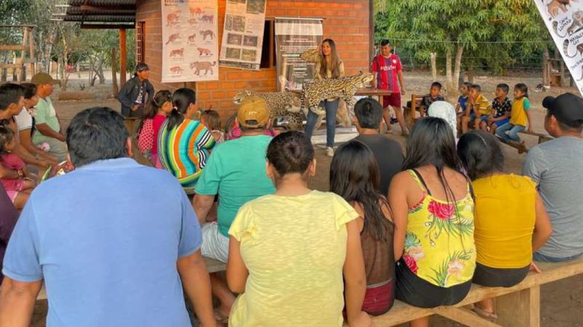 People watching a presenter talk about jaguars