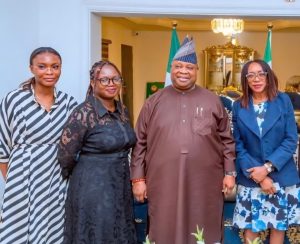A group of leaders stand next to each other, smiling at the camera.