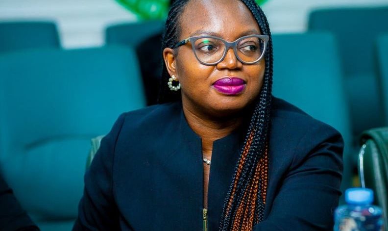 Elizabeth sitting in a business setting.