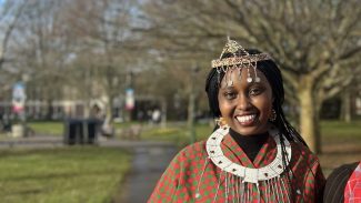 Two women standing in traditional masaai clothes