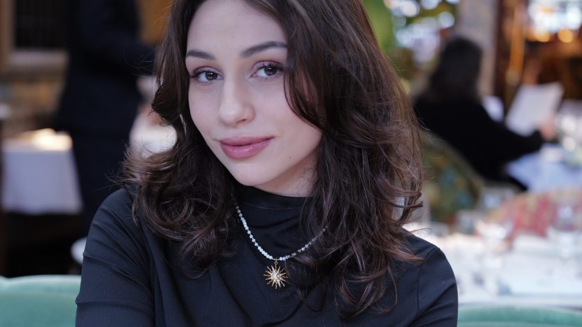 Woman looking at a camera smiling