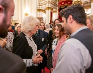 Heela, and others, meeting Queen Camilla at an event.